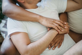 an older man and a woman cuddling