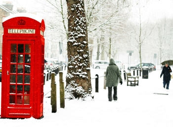 a London phone box covered in snow