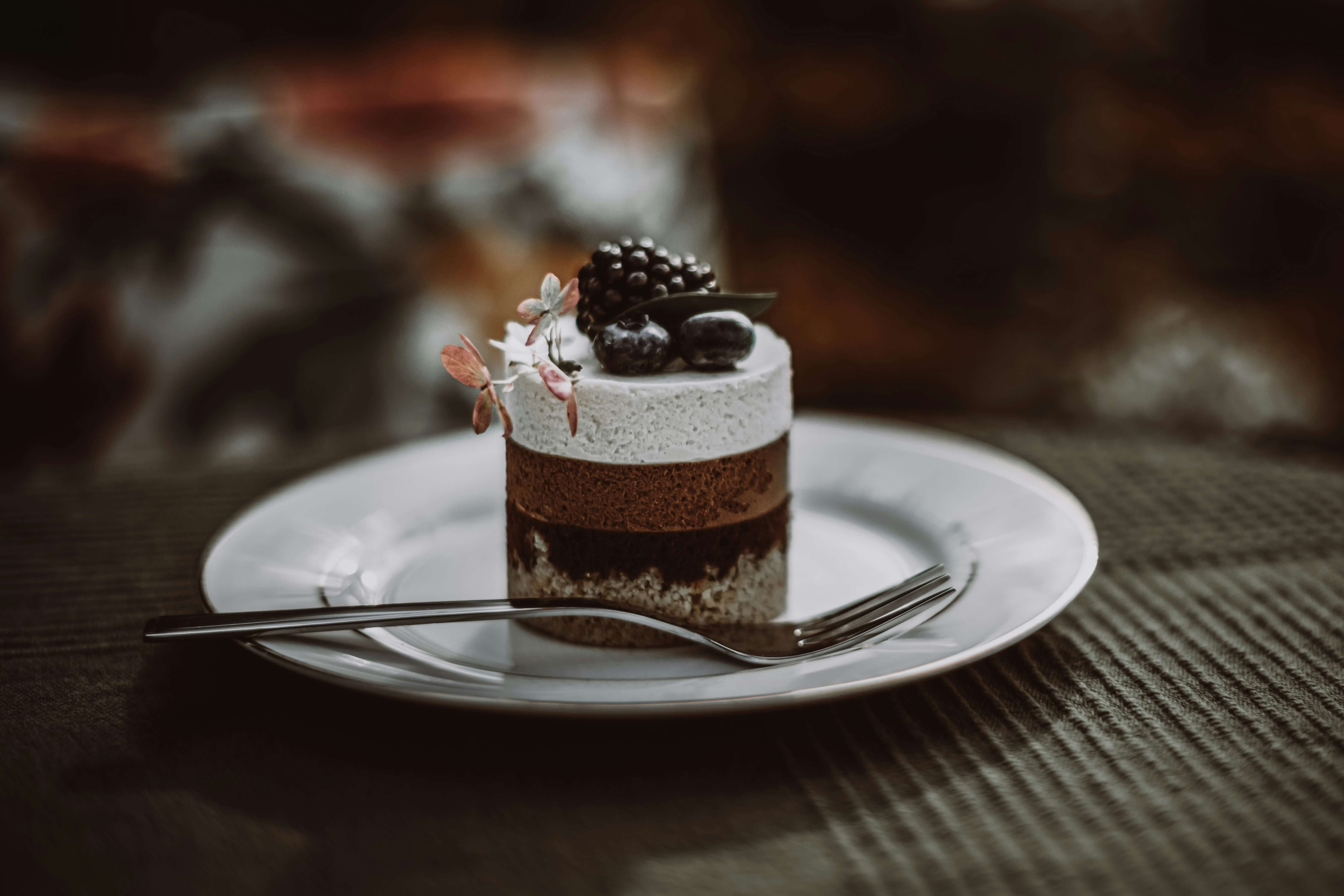 a chocolate dessert with a fork on a table at a London restaurant