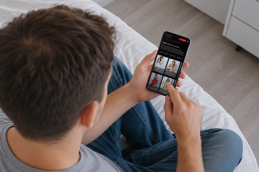 Man browsing Indian escorts on his phone