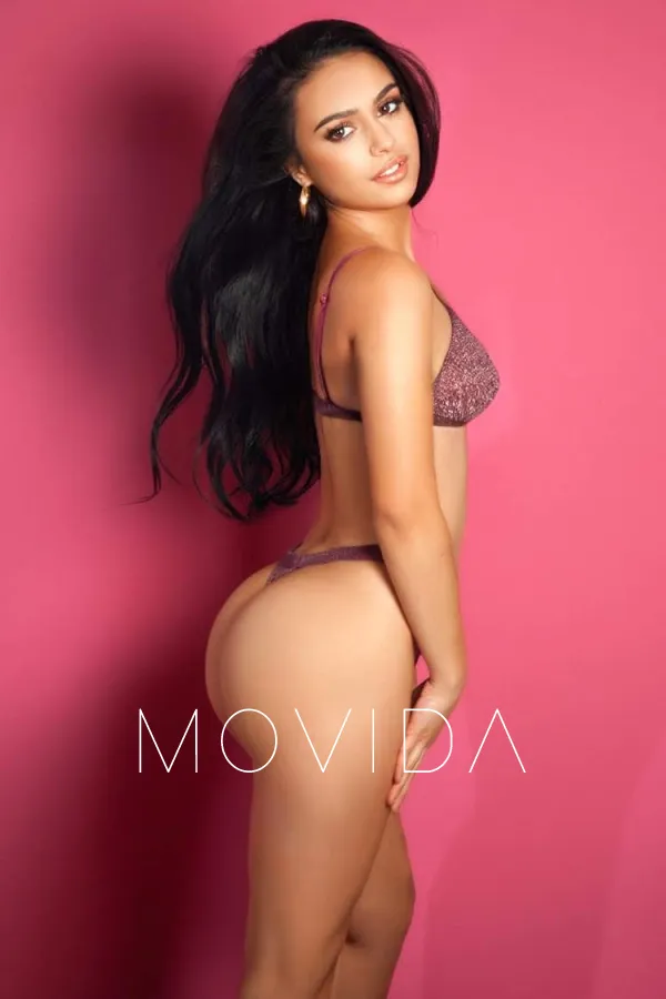 Amanda standing in a brown set of lingerie while showing off her ass  Profile Image