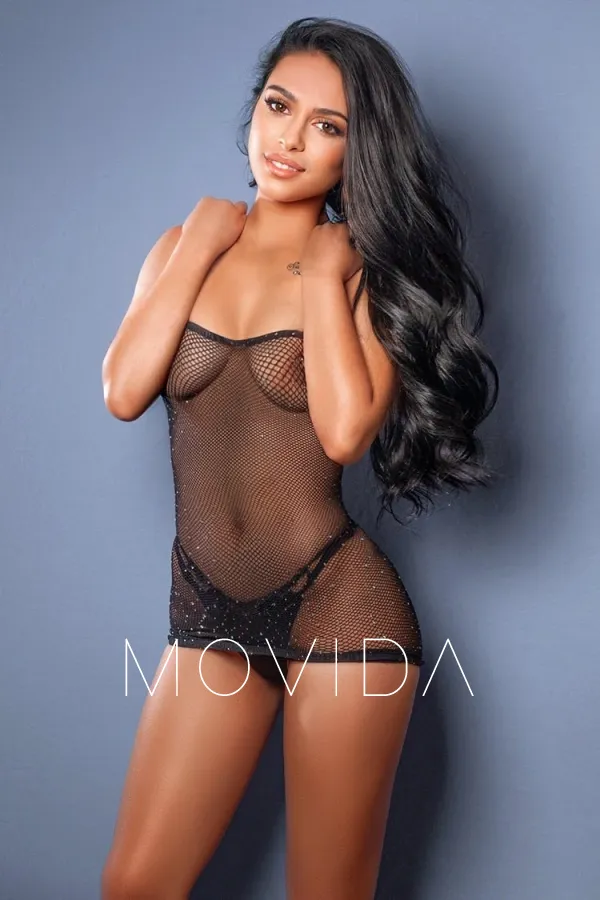 Amanda standing in a mesh top while topless  Profile Image