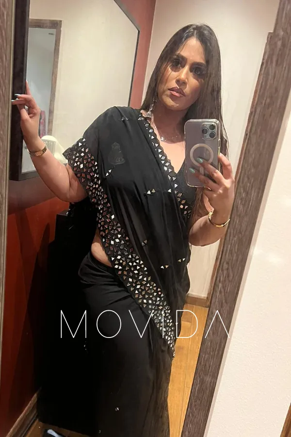 Nandini taking a selfie in a black dress Profile Image
